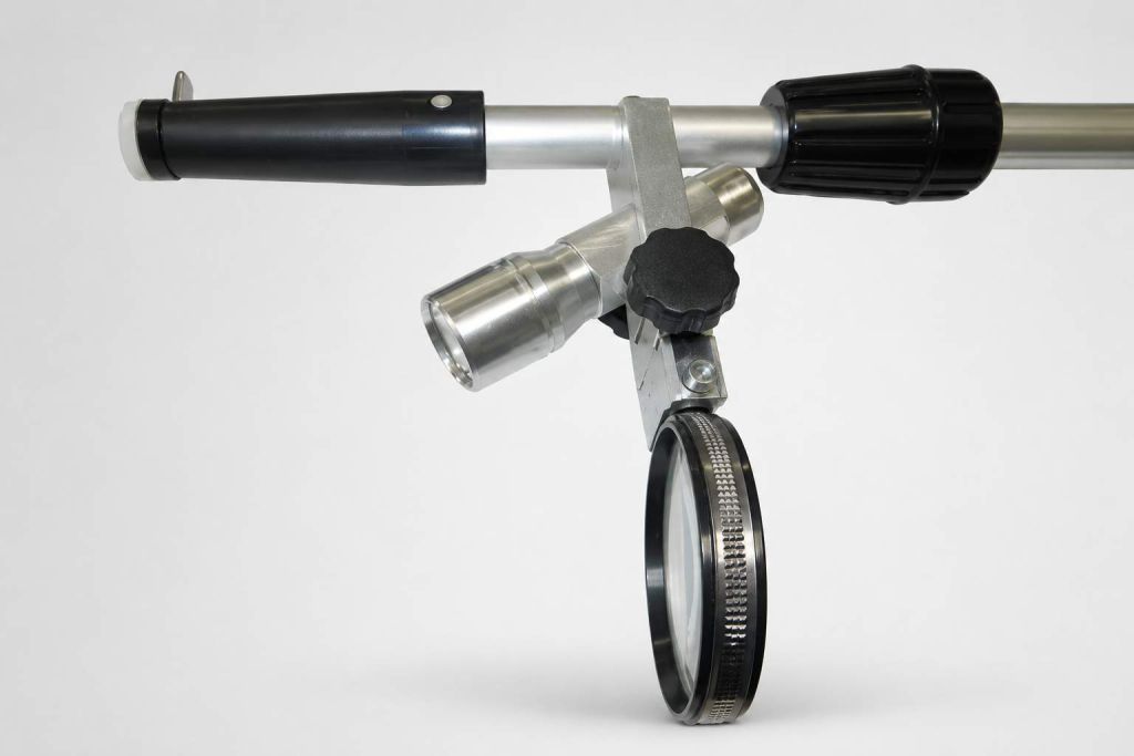 Reading stick head with LED lamp and attachable magnifier