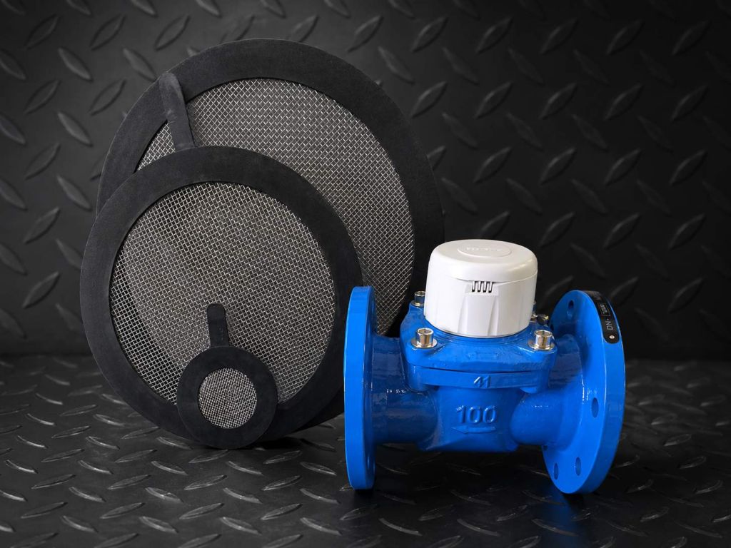 Strainer flange gasket next to a flanged water meter